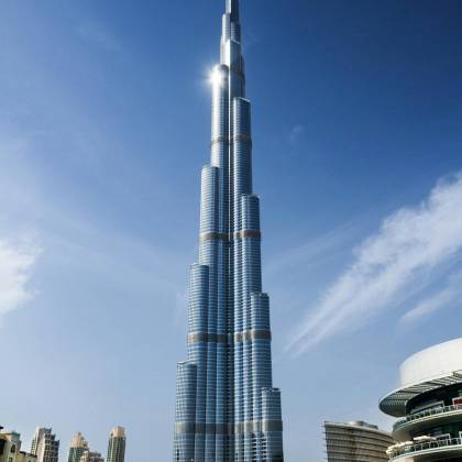 Stunning Daytime View Of Burj Khalifa Against A Clear Blue Sky In Dubai.