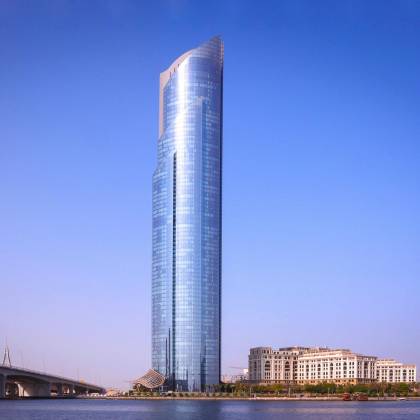 A Breathtaking View Of A Modern Skyscraper Reflecting The Sky In Dubai.