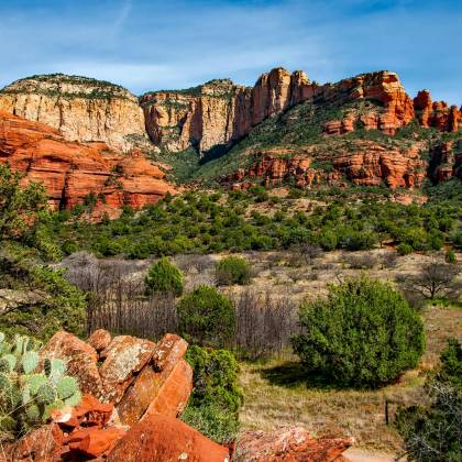 Breathtaking View Of Red Rock Formations And Lush Greenery In Sedona, Arizona.