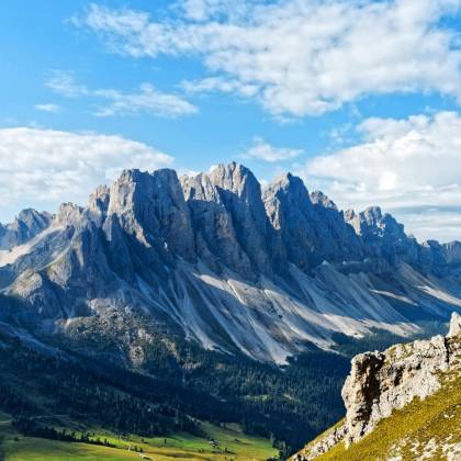 A Breathtaking View Of A Majestic Mountain Range Under A Clear Blue Sky, Perfect For Nature Enthusiasts.