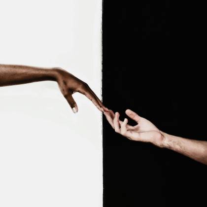 Symbolic Image Of Two Hands Reaching Toward Each Other, Representing Unity And Diversity.