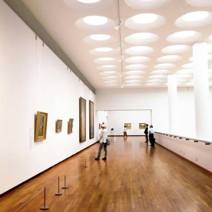 Explore A Bright And Airy Art Gallery Featuring Modern Architectural Elements And Wooden Floors.