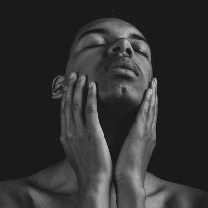 Artistic Black And White Portrait Of A Topless Man With Eyes Closed, Conveying A Serene Emotion.