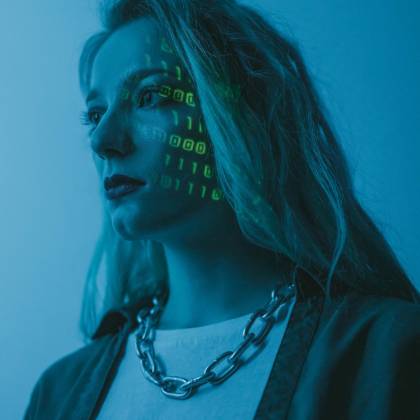 Woman With Illuminated Binary Code On Her Face, Artistic Tech Concept.