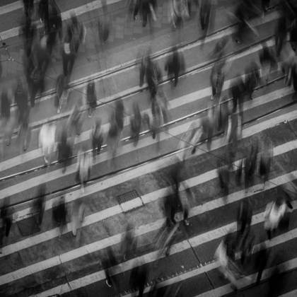 Blurred Pedestrians Crossing A Busy Hong Kong Street, Showcasing Urban Movement And Dynamics.