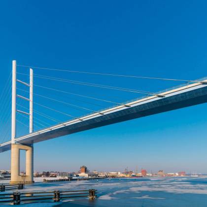 Beautiful Rügen Bridge Over Frozen Water On A Clear Winter Day In Stralsund, Germany.