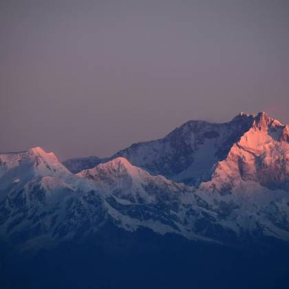 Breathtaking Sunset View Of Snow Capped Mountains In Nepal, Perfect For Scenic Backgrounds.